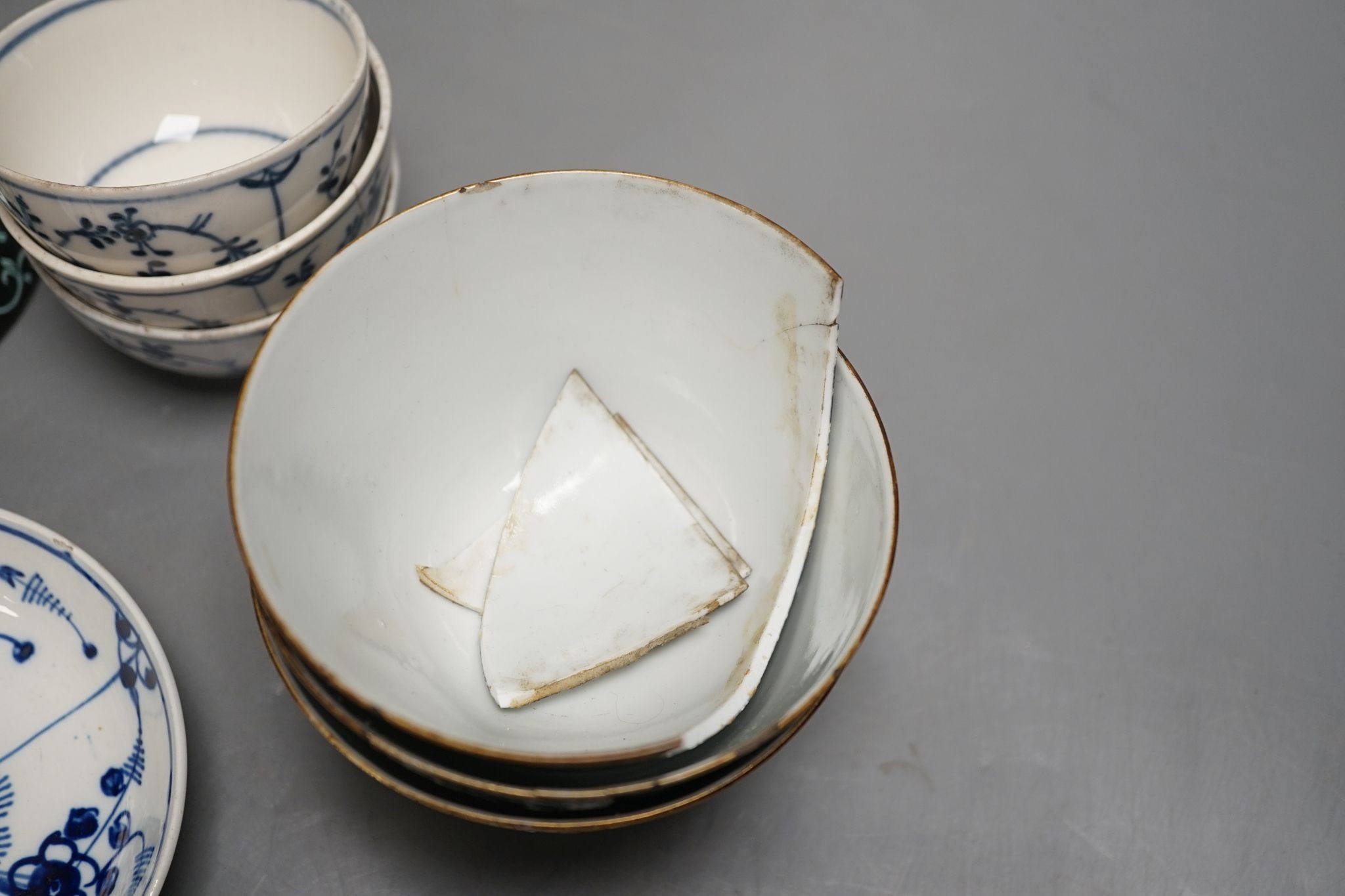 A 19th century Chinese black ground porcelain bowls and two covers, together with an three onion pattern blue and white tea bowls and saucers a/f